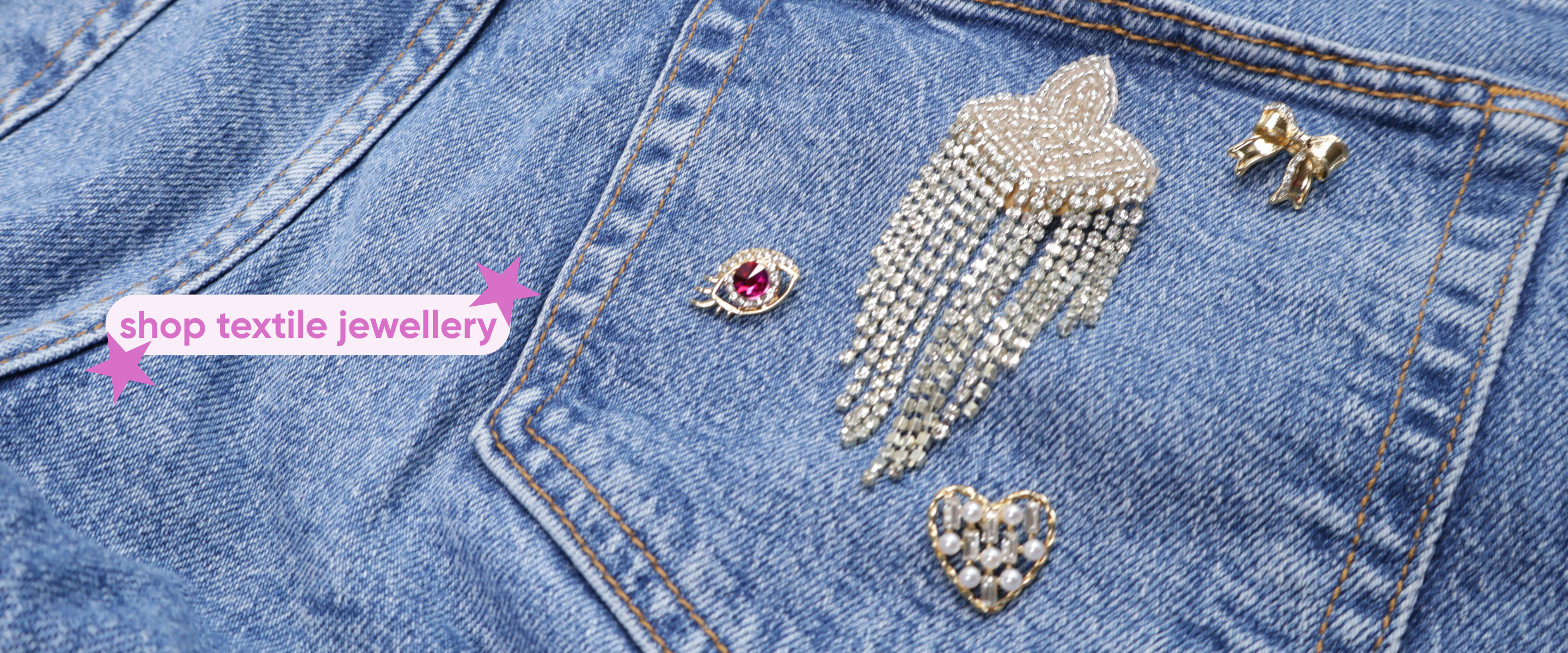 Brooch and pin on blue jeans