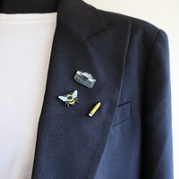 20014_20006_20000_pin_camera_near_pencil_on_blazer
