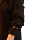 Gold sleevholder with 2 balls on black blazer