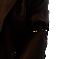 Gold sleevholder with 2 balls on black blazer