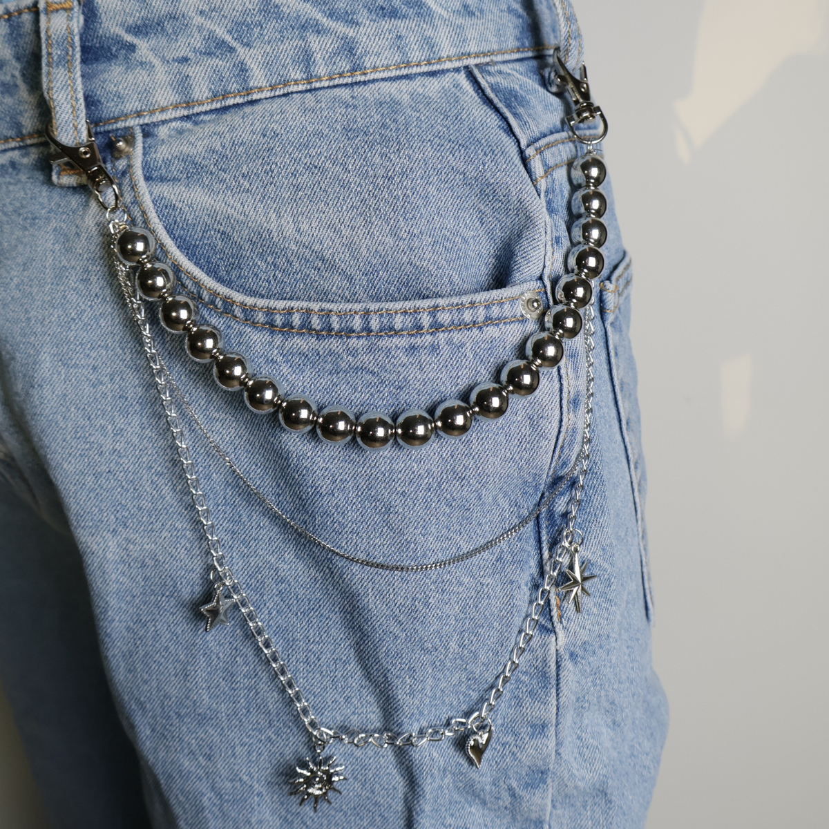 trouser chain silver with beads and charms on blue jeans