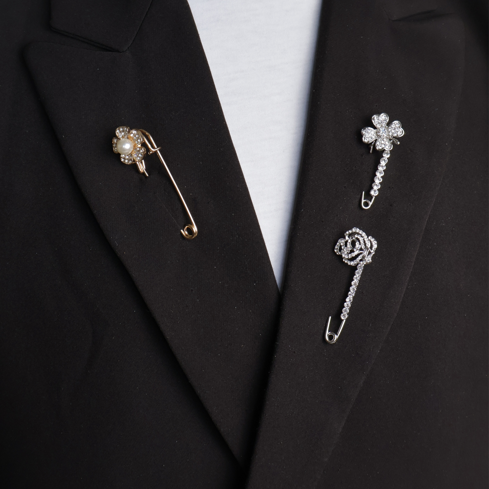 Veiligheidsspeld goud en zilver bloem met parel